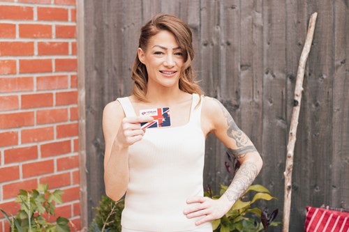 Amber holding up a Veterans' Lottery card