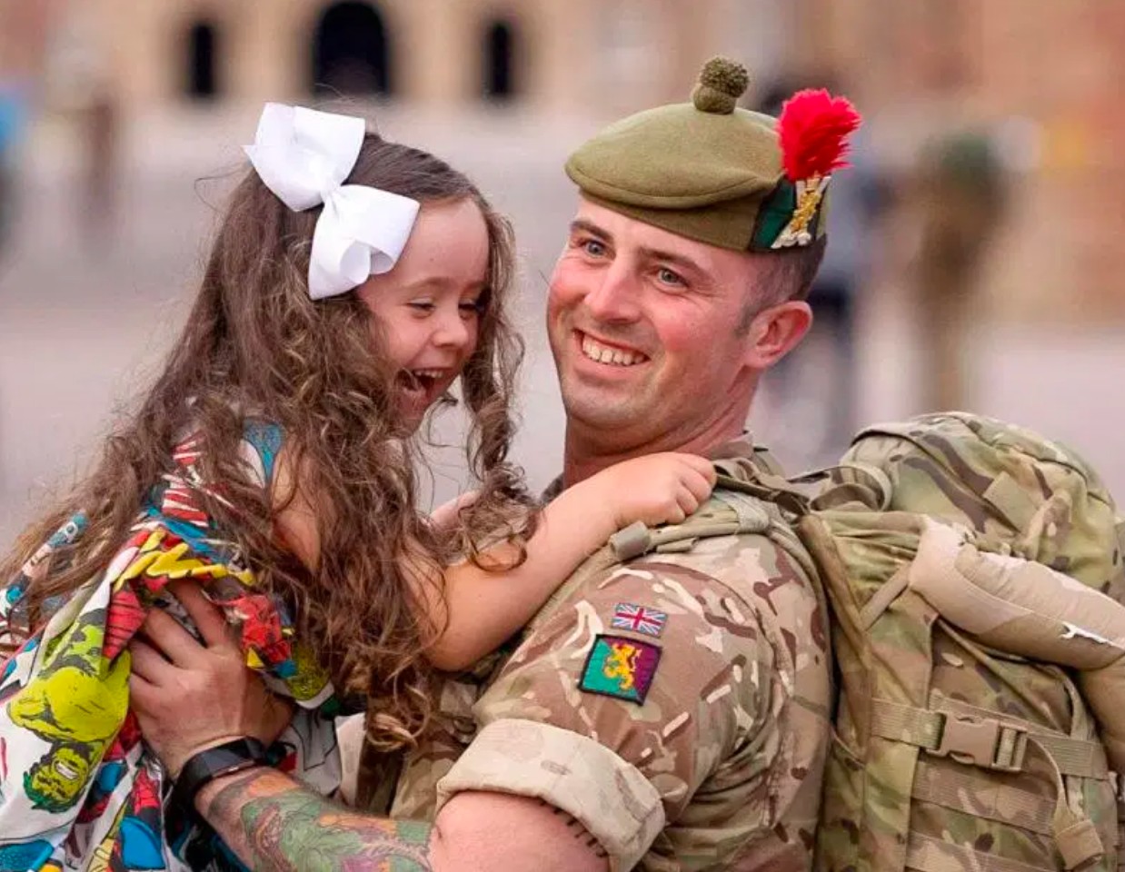 Soldier holding daughter