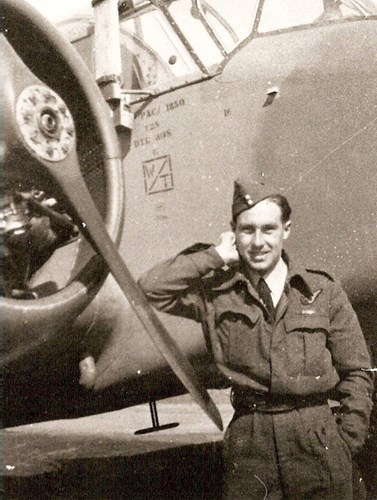 Peter Rackliff standing next to A Halifax V bomber