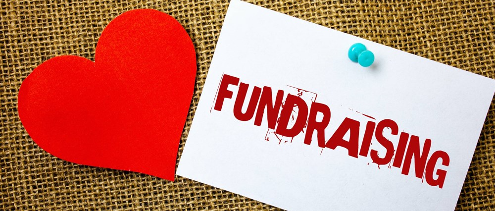 Paper heart next to the word Fundraising
